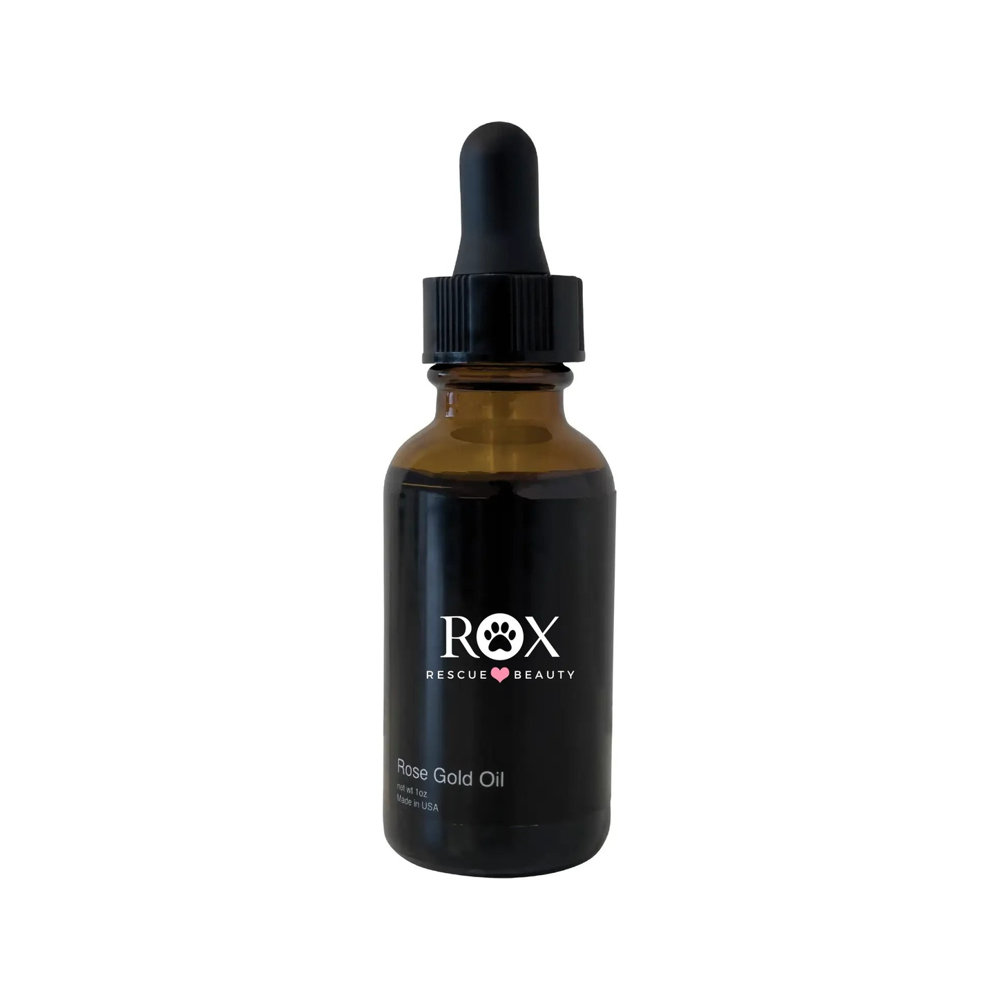 An amber-colored glass bottle with a dropper containing luxurious anti age rose gold oil serum by Rox Rescue Beauty