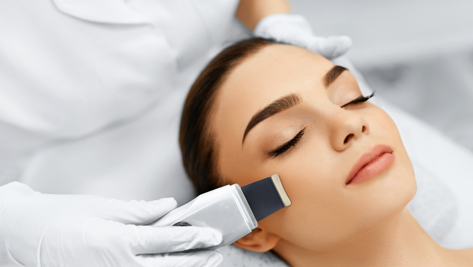 A beautiful girl receiving an Ultrasound Facial from an experienced Esthetician